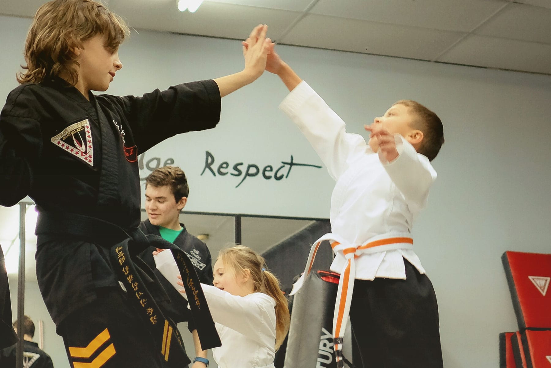 Warrior kids stretching at Ultimate Leadership Martial Arts Cincinnati